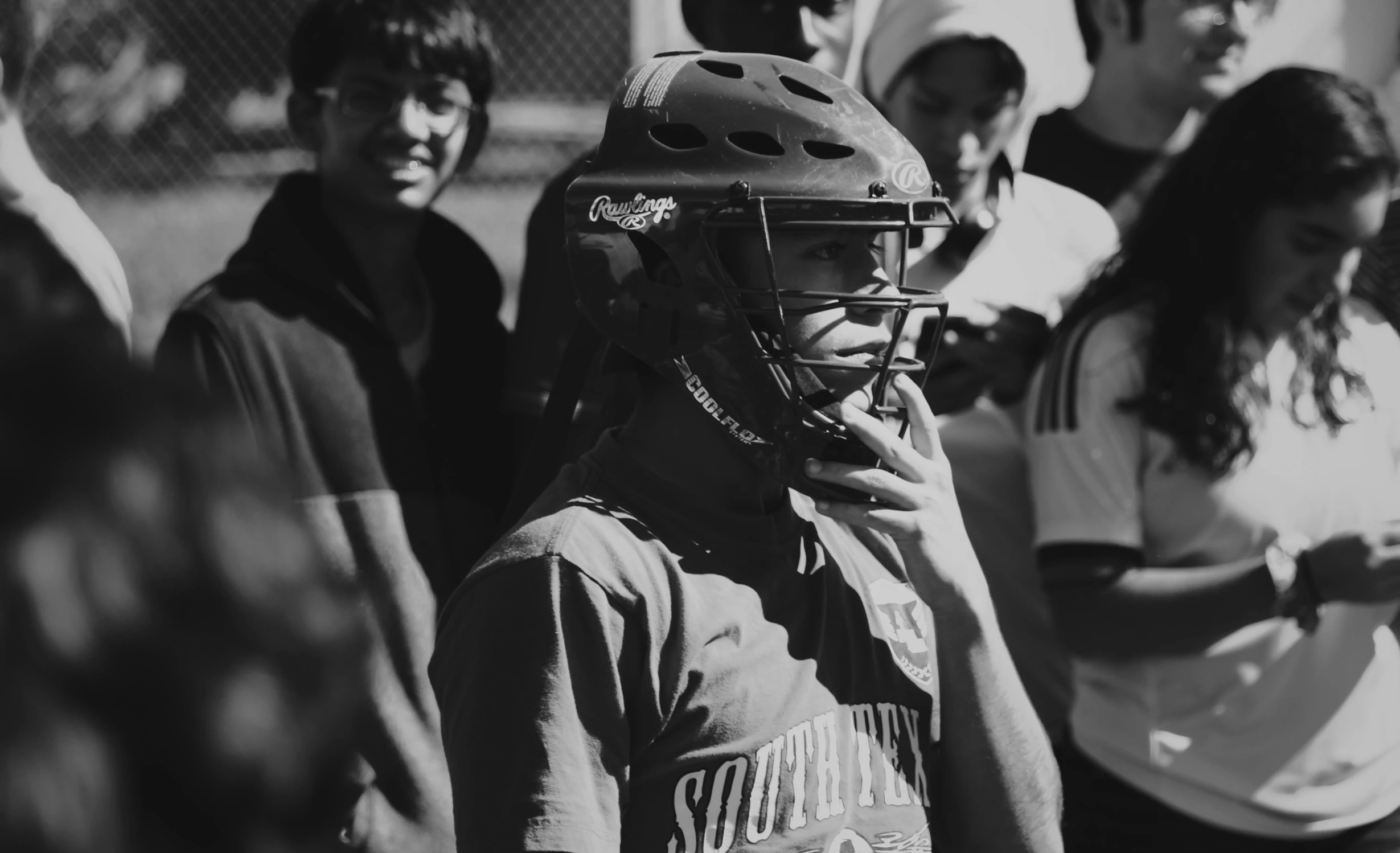 a group of young people standing next to each other, a black and white photo, by Sebastian Vrancx, pexels contest winner, female baseball player, helmet on face, young southern woman, black female