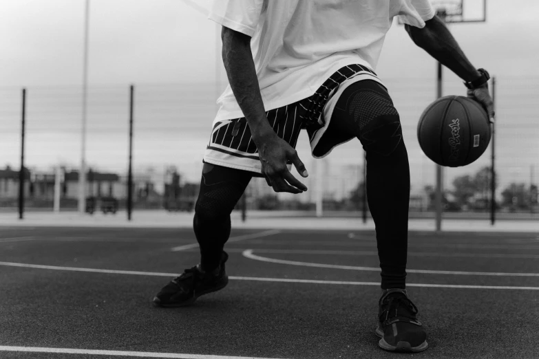 a man is playing a game on a basketball court