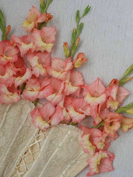 a bunch of pink flowers sitting on top of a table, victorian lace, medium closeup, listing image, iris