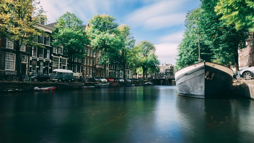 a boat that is sitting in the water, by Jan Tengnagel, pexels contest winner, happening, canals, lush surroundings, thumbnail, olivia kemp