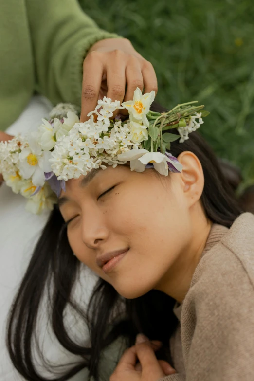 a woman laying down with a flower crown on her head, inspired by Kim Tschang Yeul, zoomed in, herbs, slide show, seasonal