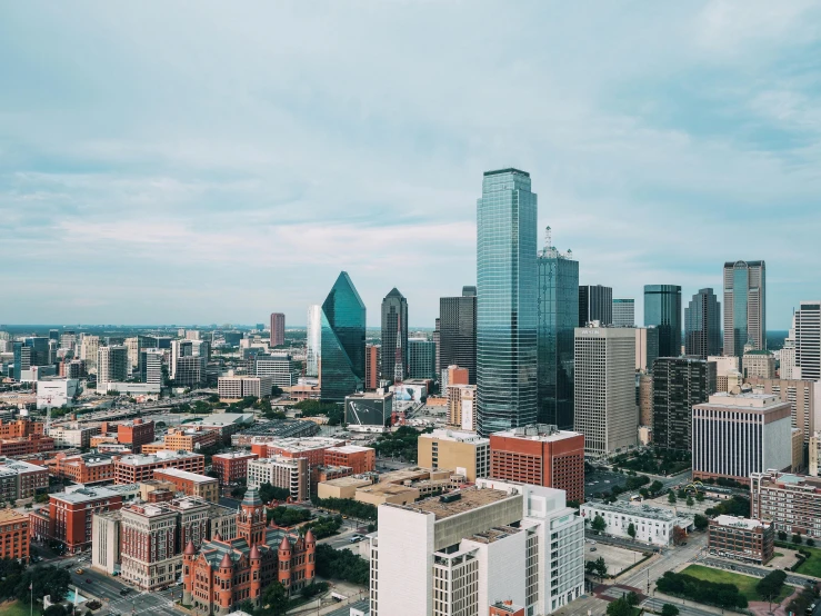 a view of a city from the top of a building, by Carey Morris, pexels contest winner, grassy knoll, drone footage, 2 0 2 2 photo, crisp detail