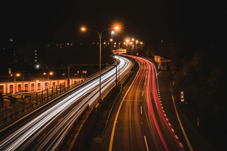 a city street filled with lots of traffic at night, by Niko Henrichon, pexels contest winner, speed lines, long highway, thumbnail, stacked image