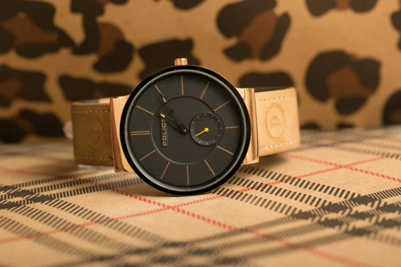 a close up of a watch on a table, a portrait, inspired by Róbert Berény, unsplash, bauhaus, muted brown yellow and blacks, the smooth black lioness, relaxed. gold background, rosen zulu