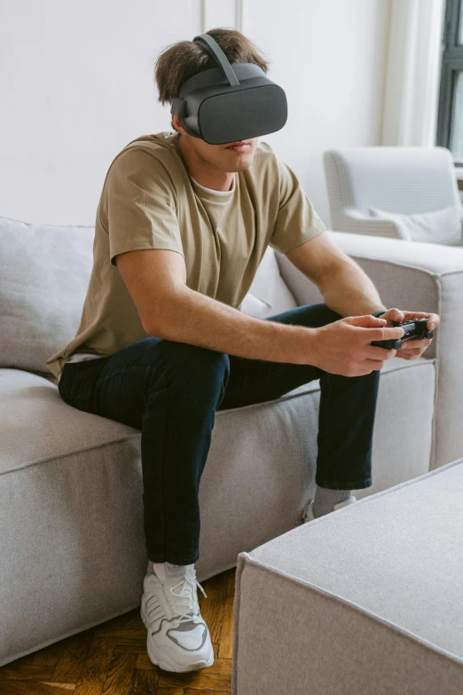 a man sitting on a couch wearing a virtual reality headset, reddit, tabletop gaming, unreal engine ;, instagram picture, game cover