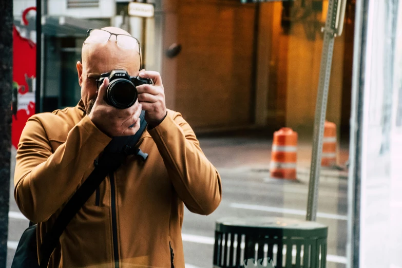 a man taking a picture of himself with a camera, inspired by Vivian Maier, pexels contest winner, telephoto, color ( sony a 7 r iv, street pic, over the shoulder