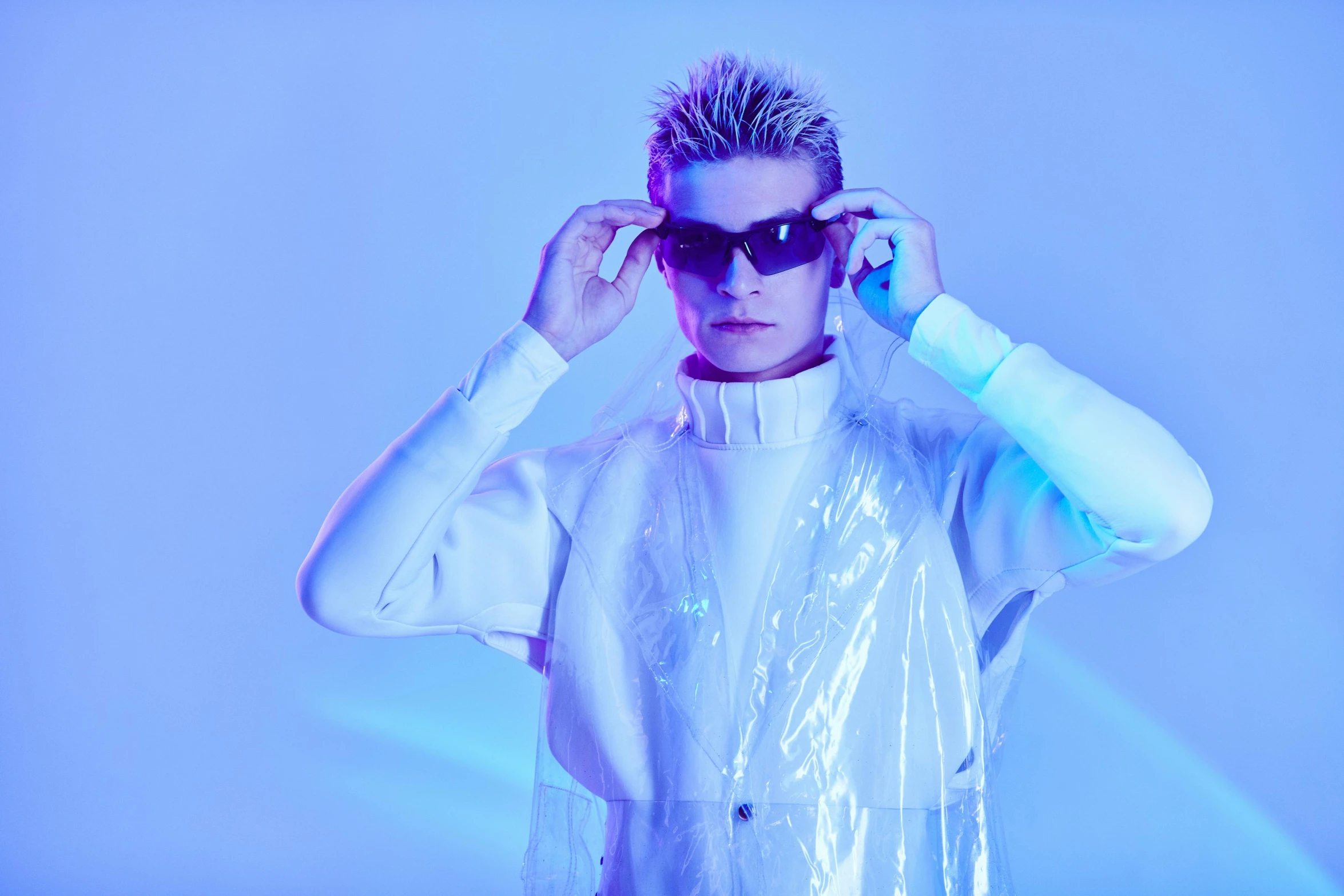 a man in a white shirt and sunglasses, an album cover, inspired by Nikolaj Abraham Abildgaard, trending on pexels, neo-dada, holographic suit, platinum blond, ryan jia, alien like