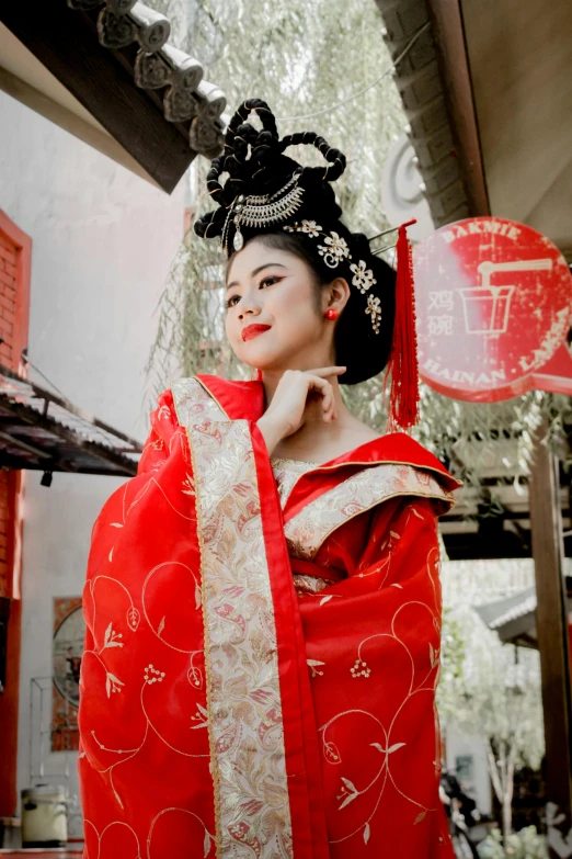 a woman in a red kimono is posing for a picture, inspired by Lan Ying, pexels contest winner, square, lovely queen, 💣 💥💣 💥, ethnicity : japanese