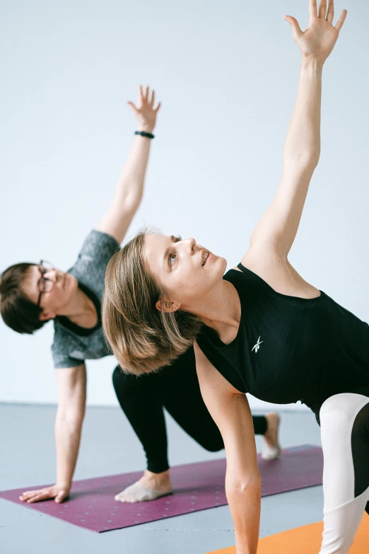 a group of people doing yoga together, by Rachel Reckitt, studio photo, lena oxton, low quality photo, corners