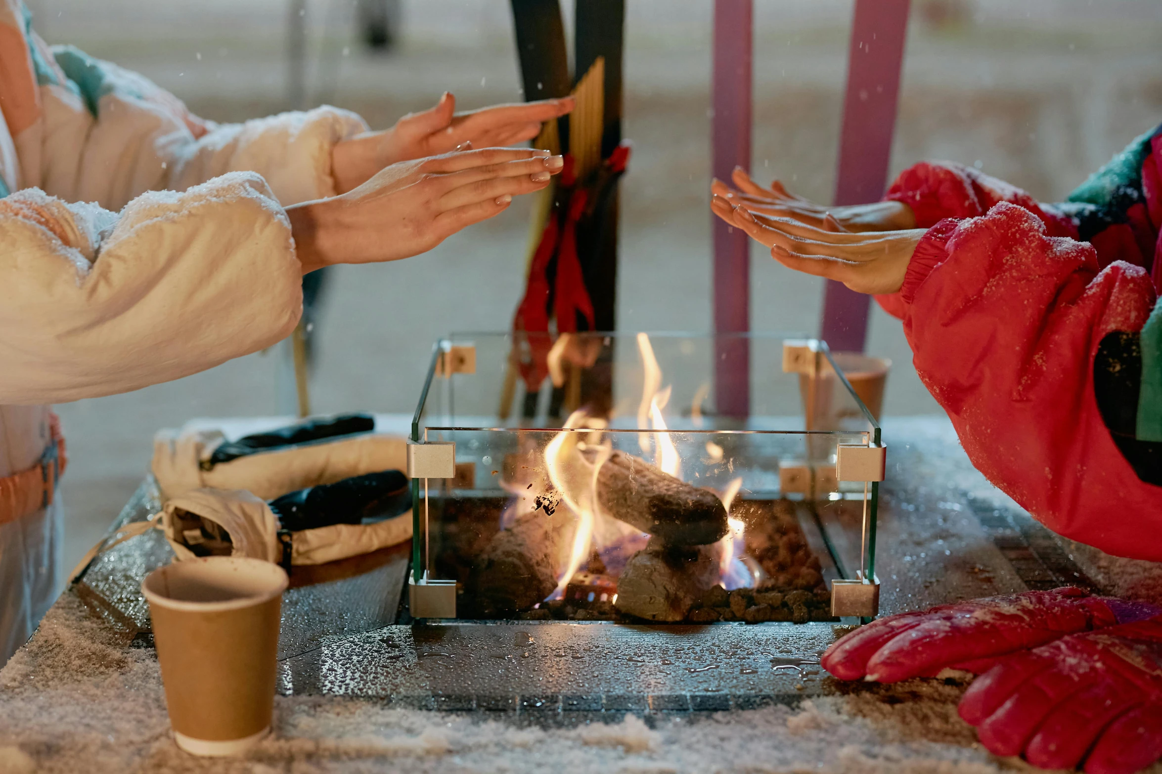 two women toasting marshmallows over a campfire, by Julia Pishtar, inside in a glass box, winter vibes, giving gifts to people, square