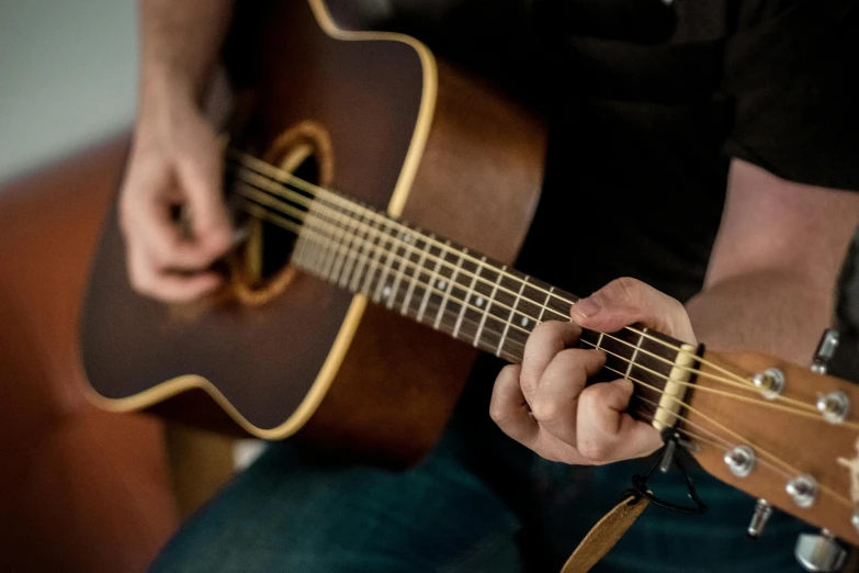 a close up of a person playing a guitar, inspired by James Bard, pexels contest winner, figuration libre, half length, australian, “the ultimate gigachad, at home