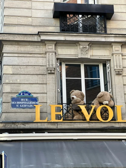 a couple of teddy bears sitting on top of a building, inspired by Louis Buvelot, signboards, 🚿🗝📝, on loan from louvre, storefront