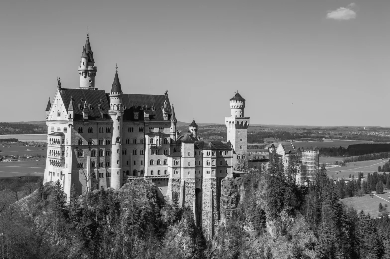 a black and white photo of a castle, by Werner Gutzeit, pexels contest winner, fan favorite, high towers, beautiful high resolution, overlooking