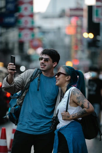 a man standing next to a woman on a city street, pexels contest winner, happening, cyborg - pitbull taking a selfie, non-binary, humans of new york, asian male