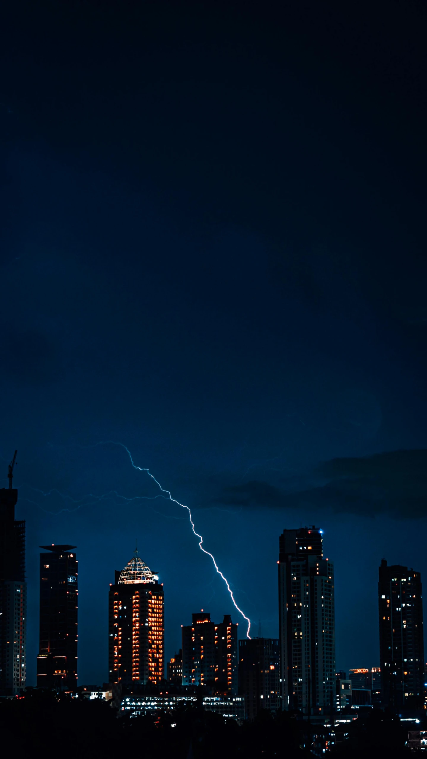 a city at night with a lightning bolt in the sky, by Adam Chmielowski, unsplash contest winner, minimalism, shot on sony a 7, ::