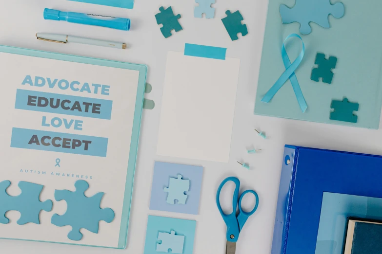 a book sitting on top of a table next to a pair of scissors, a jigsaw puzzle, featured on behance, academic art, blue and cyan scheme, indiecraft aesthetic, medical supplies, thumbnail