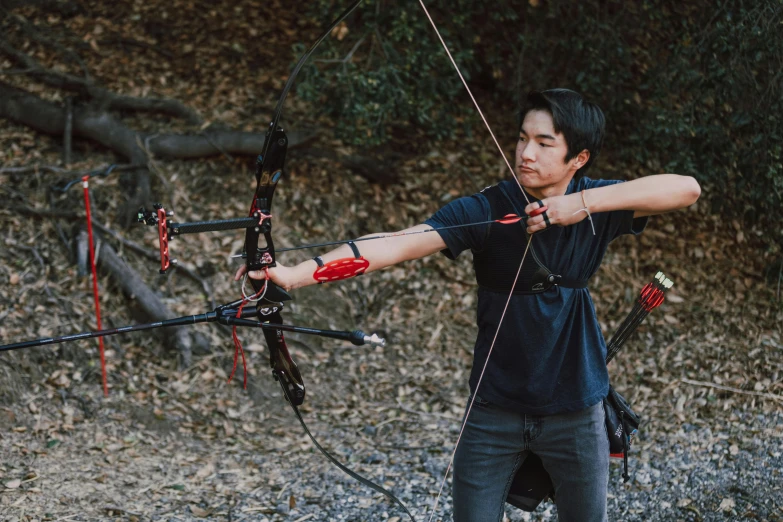 a man that is standing in the dirt with a bow, eric hu, flying arrows, bay area, avatar image
