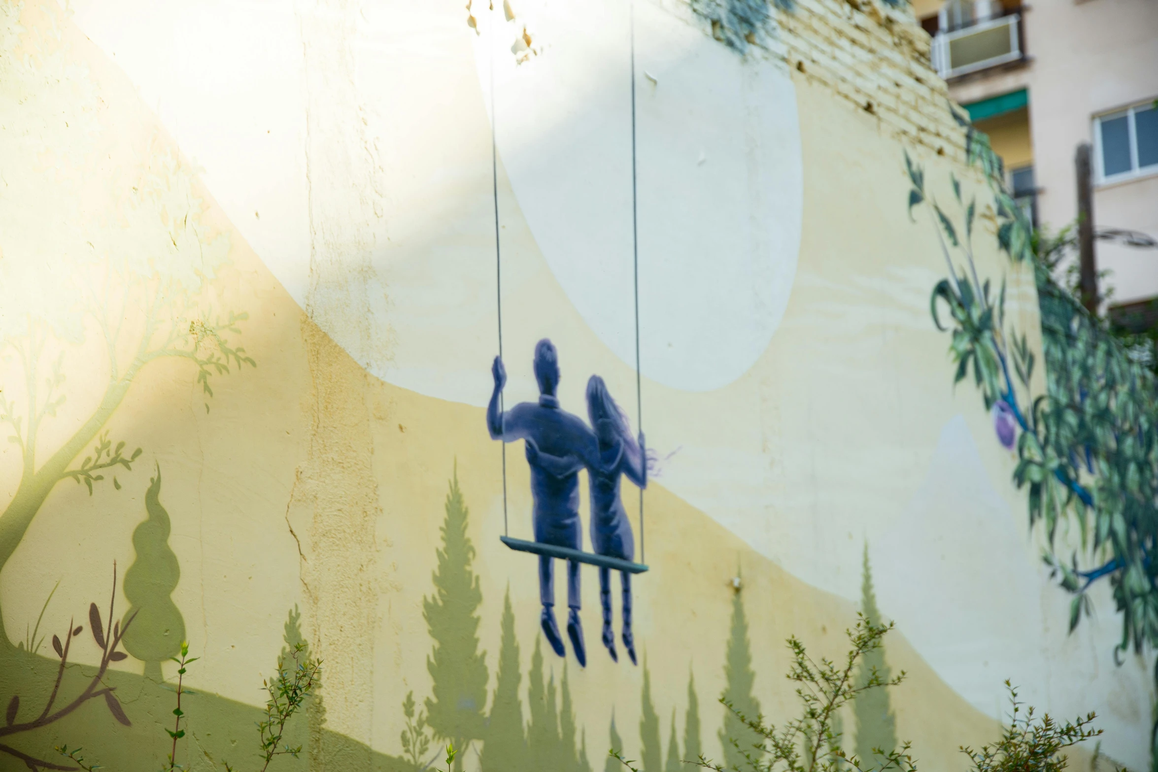 a painting of two people on a swing, inspired by Aaron Douglas, pexels contest winner, street art, shot on sony a 7, wall painting, simin stalenhag, outdoor photo