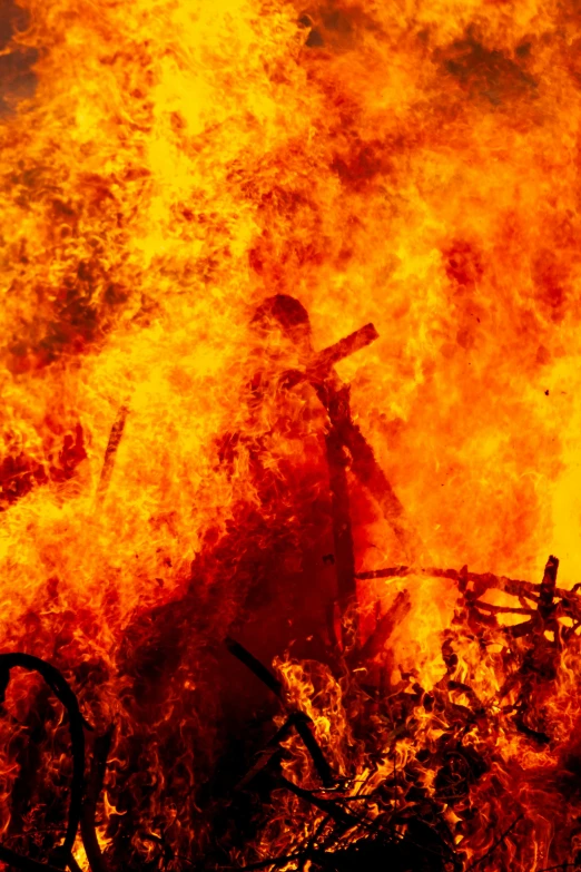 a man that is standing in front of a fire, firenado, slide show, getty images, jesus christ is the doom slayer