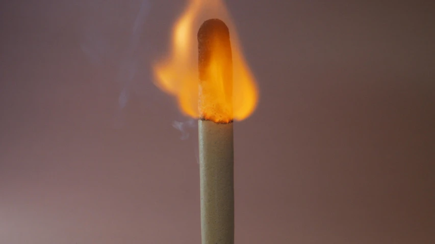 a lit matchstick with a flame coming out of it, inspired by William Harnett, unsplash, auto-destructive art, made of glowing wax and ceramic, pastelle, rinko kawauchi, hot dog