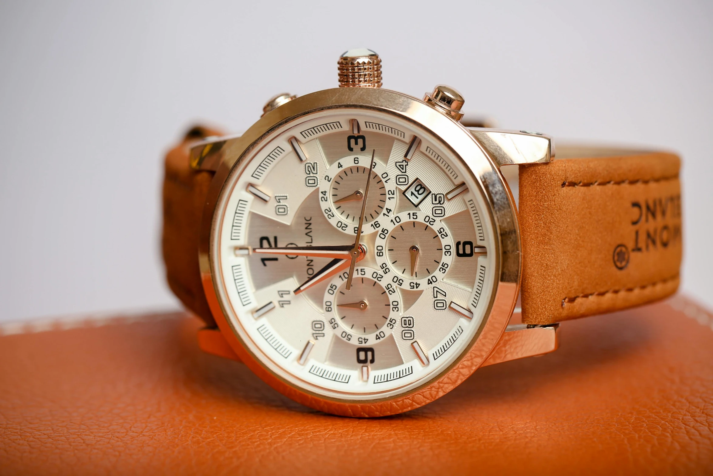 a watch sitting on top of a brown bag, trending on pexels, photorealism, ivory and copper, full front view, dynamic closeup, various posed