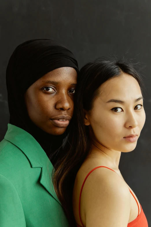 a couple of people standing next to each other, inspired by Wang Duo, renaissance, adut akech, black and green, young asian woman, skin tones