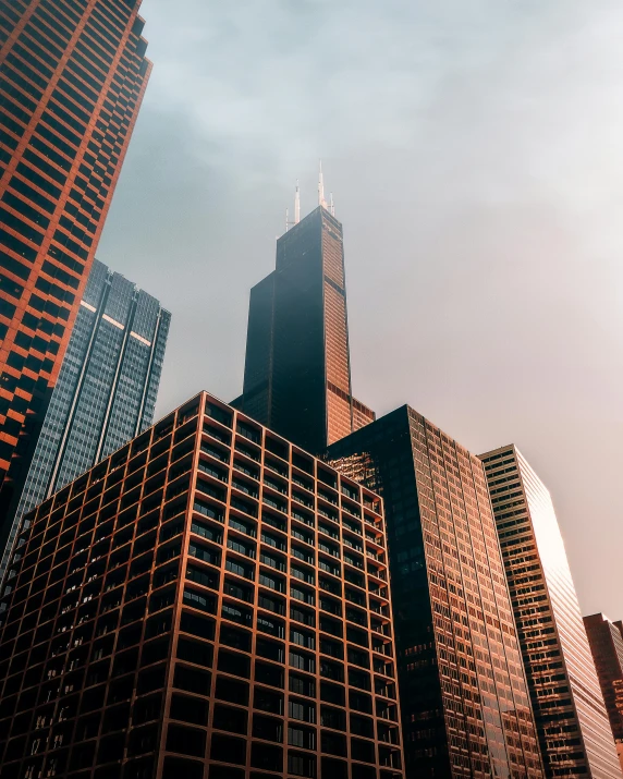 a group of tall buildings sitting next to each other, by Jacob Burck, pexels contest winner, lgbtq, chicago, background image, exterior