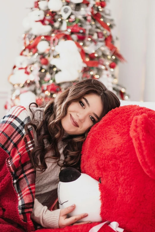 a woman laying on a couch with a red teddy bear, tachisme, sitting on santa, headshot profile picture, ✨🕌🌙, 18 years old