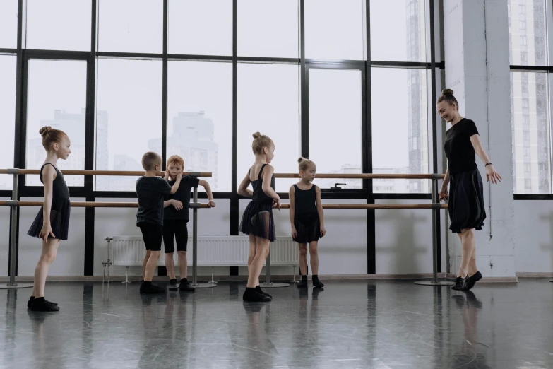 a group of children standing in front of a window, by Liza Donnelly, arabesque, standing in class, lachlan bailey, profile image