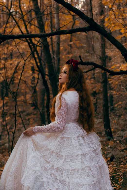 a woman in a wedding dress standing in the woods, an album cover, inspired by Elsa Bleda, pexels contest winner, renaissance, 🍂 cute, young victorian sad fancy lady, red waist-long hair, intricately