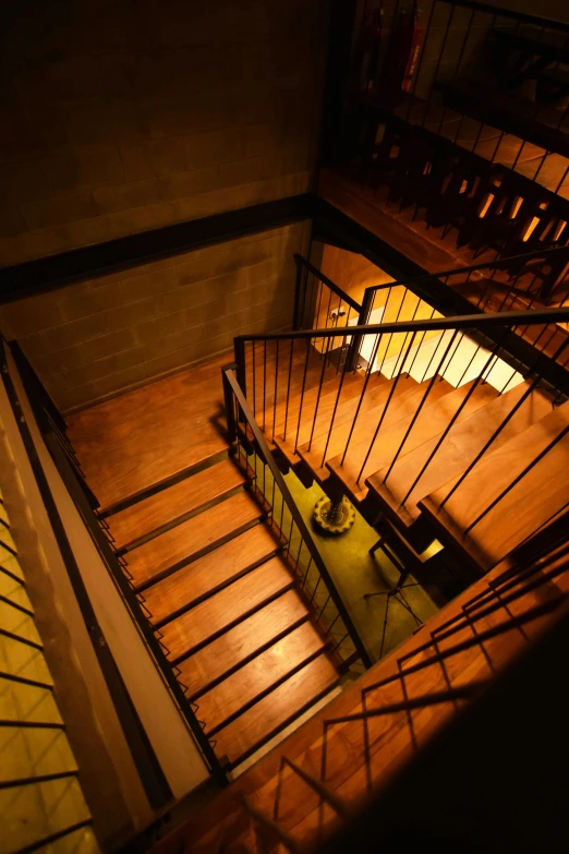 an overhead view of a staircase in a building, by Sengai, renaissance, dramatic lighting !n-9, cellar, indoor picture