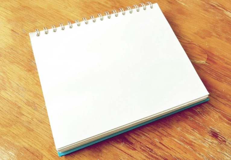 a notepad sitting on top of a wooden table, square, illustratioin, whiteboard, no text
