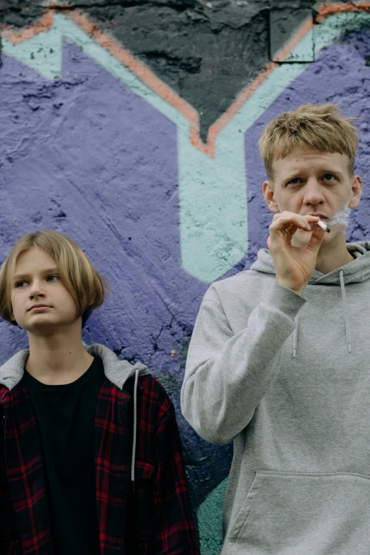 a couple of young men standing next to each other, an album cover, unsplash, graffiti, stock and two smoking barrels, nordic folk, tomboy, headshot