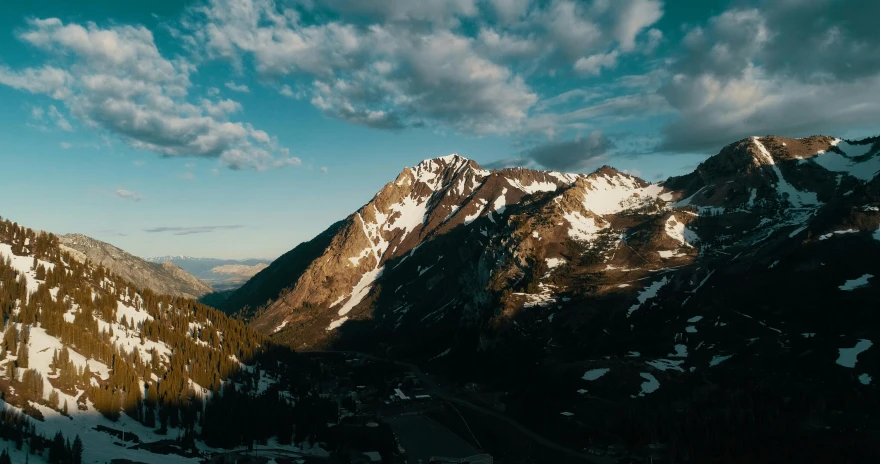 a view of the mountains from the top of a mountain, by Morgan Russell, unsplash contest winner, aerial shot from the drone, late afternoon, big sky, 4 k hd wallpapear