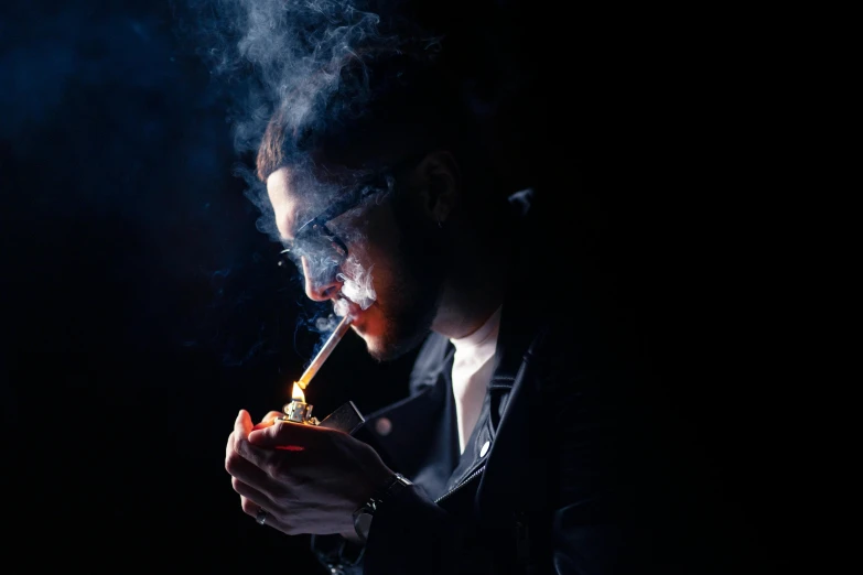 a man smoking a cigarette in the dark, an album cover, pexels contest winner, renaissance, ganja, profile image, glass and gold pipes, blue haze