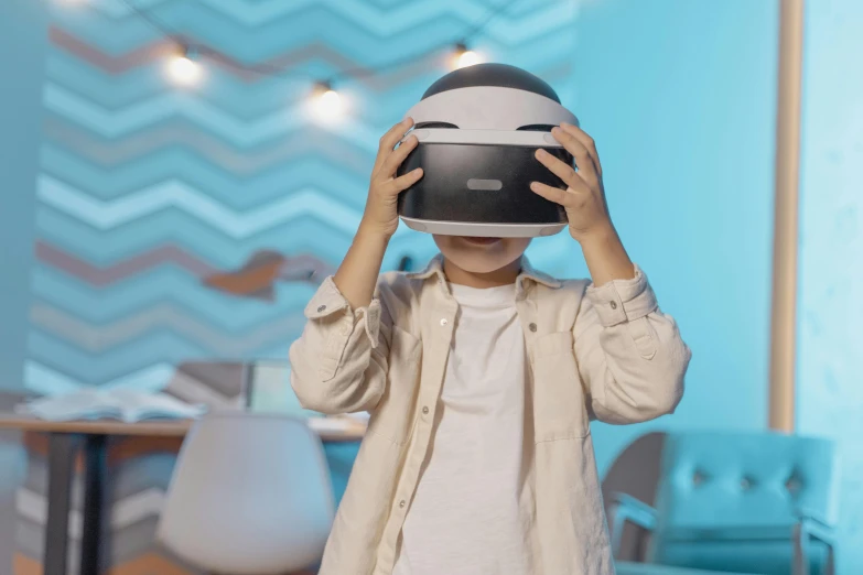 a little boy wearing a virtual reality headset, a picture, inspired by Jean Tabaud, unsplash, interactive art, wearing a round helmet, avatar image, white helmet, thumbnail