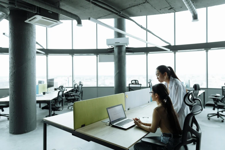 a couple of people sitting at a table with a laptop, ultrastation hq, profile image, an architectural, high angle