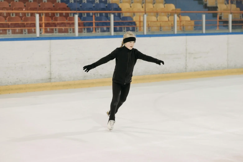 a man riding a skateboard on top of an ice rink, a picture, unsplash, arabesque, wearing a tracksuit, 15081959 21121991 01012000 4k, square, photo of the girl