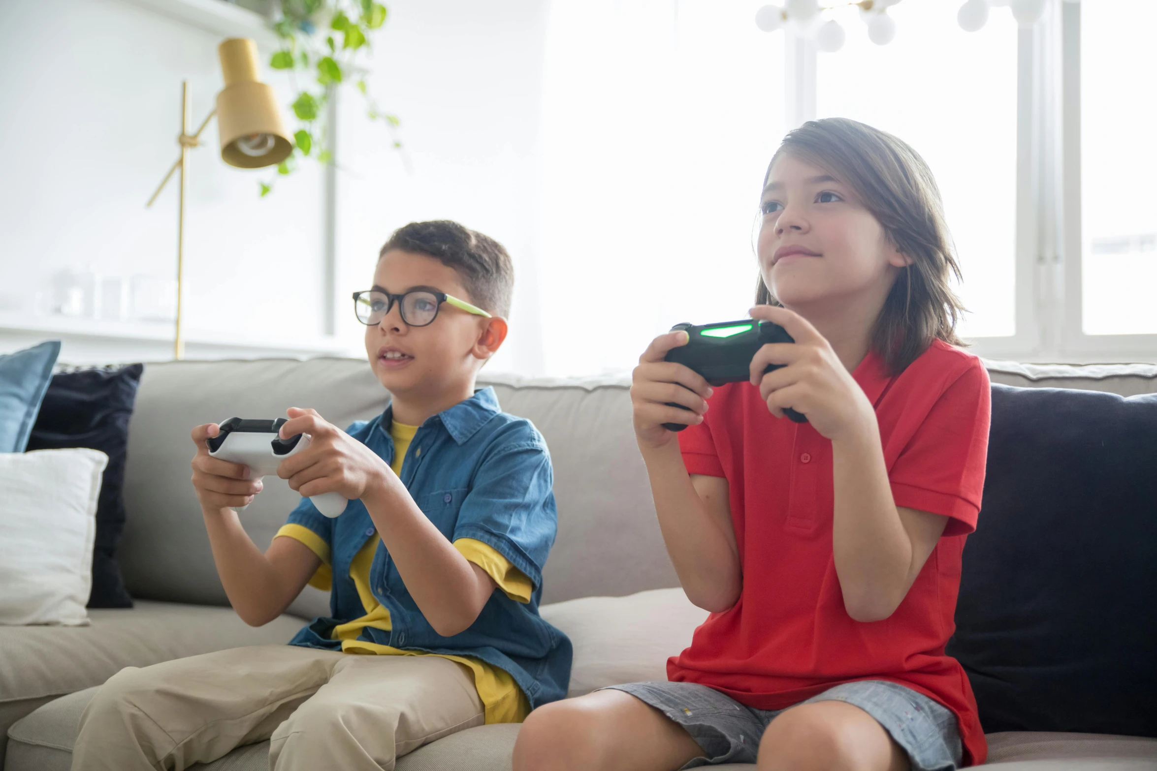 two children sitting on a couch playing video games, pexels, avatar image, portal game 9 4 4 9 9 valve, high quality picture, a green