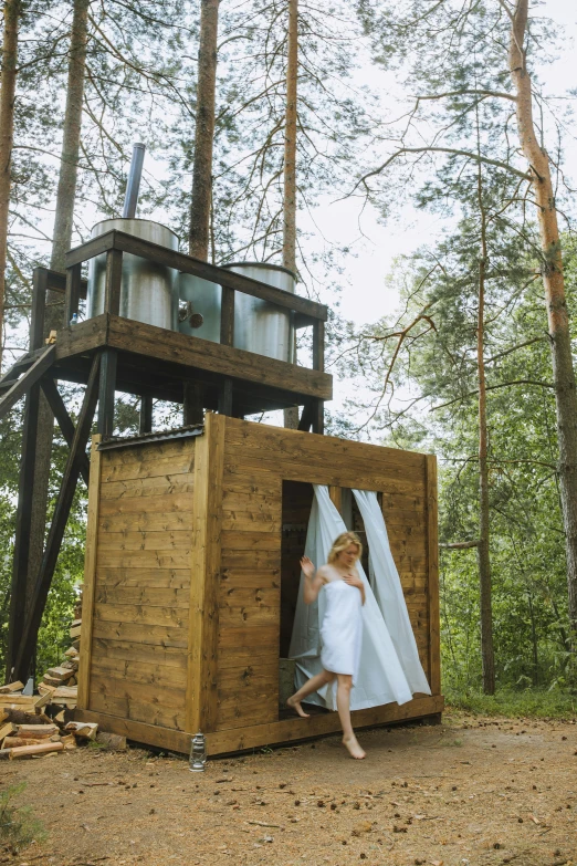 a woman standing inside of a wooden structure in the woods, toilet, wedding, space-station vuutun palaa, white