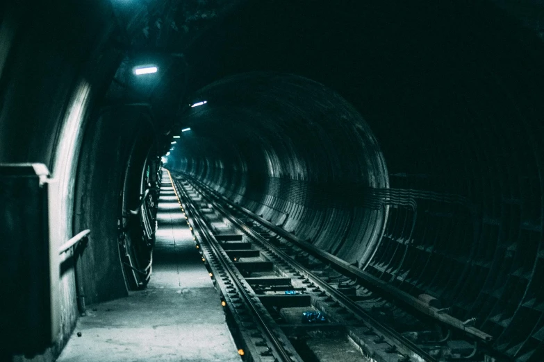 a train that is going through a tunnel, inspired by Elsa Bleda, unsplash contest winner, nuclear waste, down in the sewers of london, thumbnail, navy