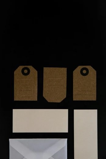 a set of envelopes and tags on a black background, by Harvey Quaytman, conceptual art, brown:-2, triptych, unframed, detail