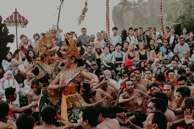 a group of people standing in front of a crowd, by Daniel Lieske, pexels contest winner, happening, javanese mythology, elaborately costumed, background image, square