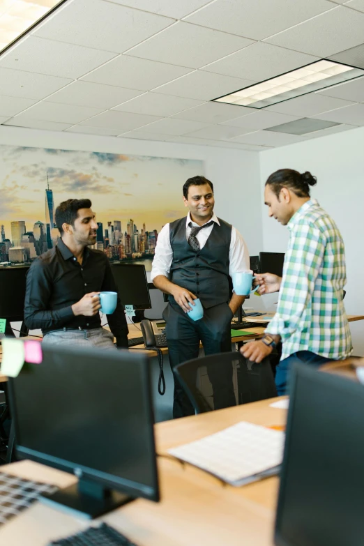 a group of people in a room with computers, bay area, talking, decorative, standing straight