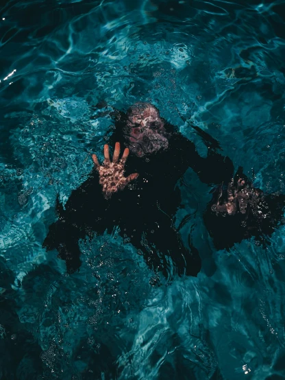 a person swimming in a body of water, an album cover, inspired by Elsa Bleda, pexels contest winner, monkey navy seals, scary picture, chimpanzee, dark aesthetic
