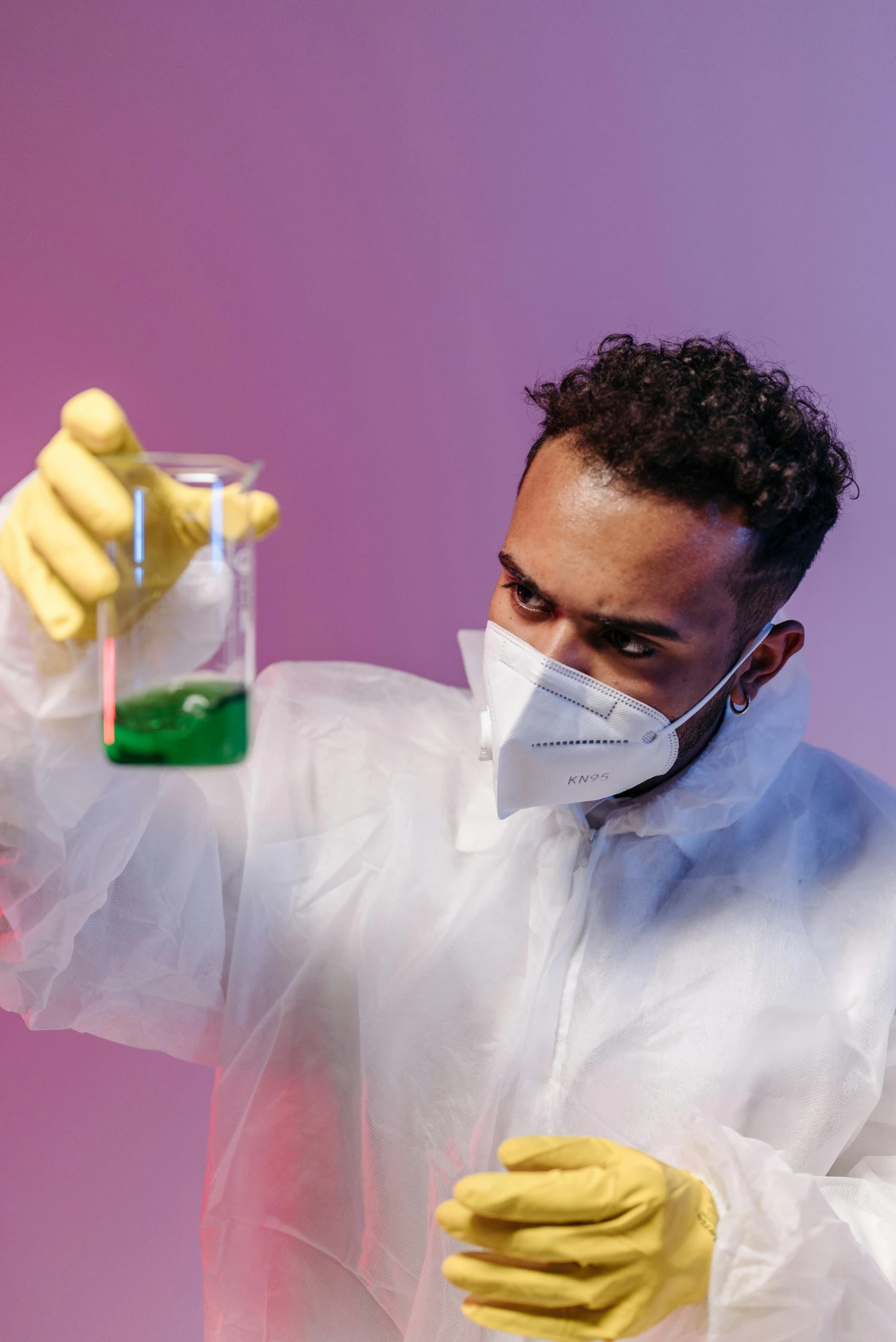 a man in a lab coat holding a flask, an album cover, trending on pexels, beakers of colored liquid, wearing gloves, tense look, diverse