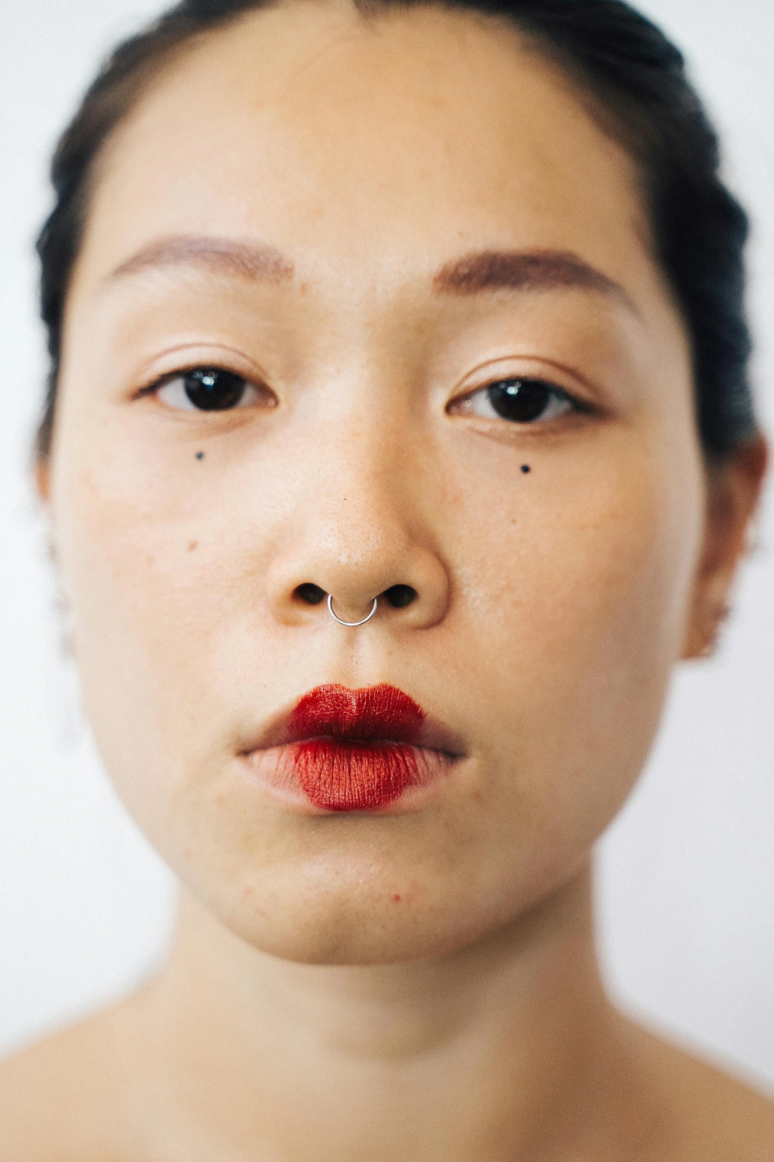 a close up of a woman with red lipstick, inspired by Taro Yamamoto, unsplash, hyperrealism, young cute wan asian face, septum piercing, ethnicity : japanese, androgynous male