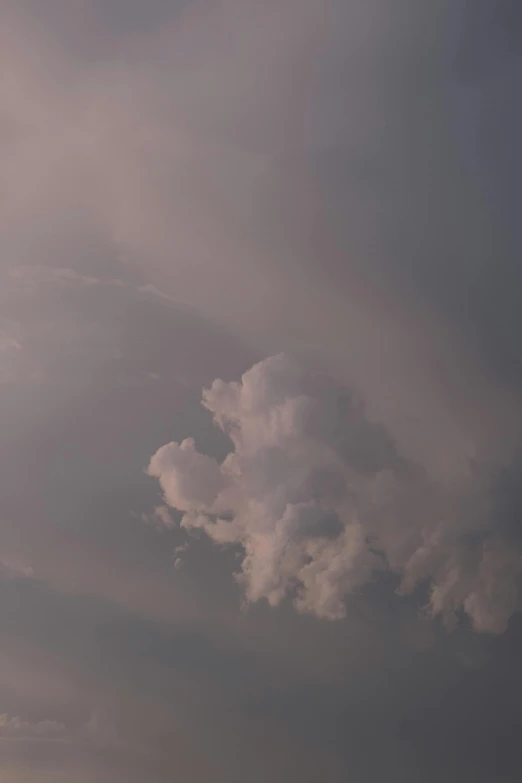 a person flying a kite on a cloudy day, a picture, by Linda Sutton, dramatic pink clouds, giant cumulonimbus cloud, atmospheric photograph, detailed clouds