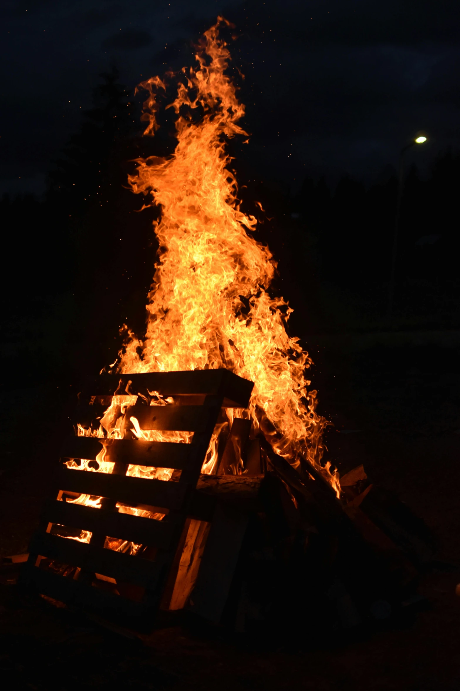 a bonfire is lit up in the dark, slide show, square, tjalf sparnaay, contain