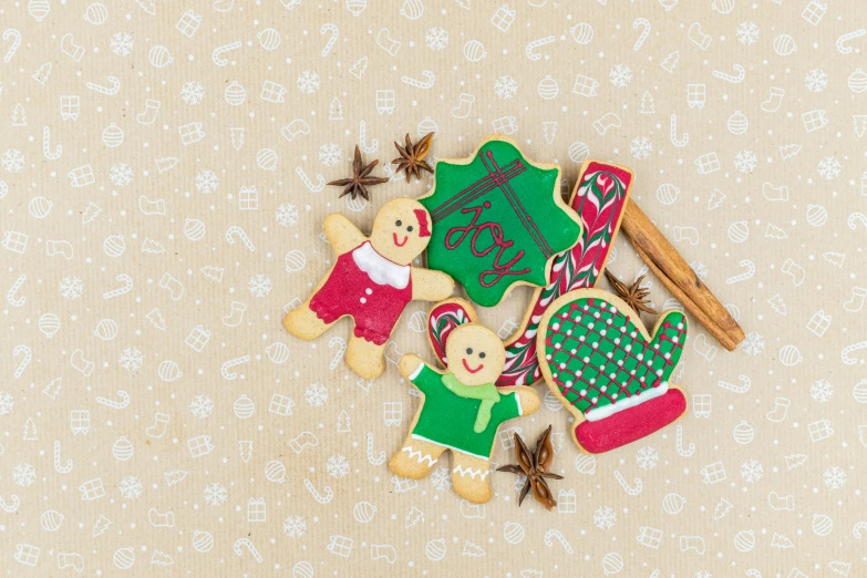 a couple of cookies sitting on top of a table, by Julia Pishtar, pexels, naive art, candy canes, green and brown clothes, paisley, listing image